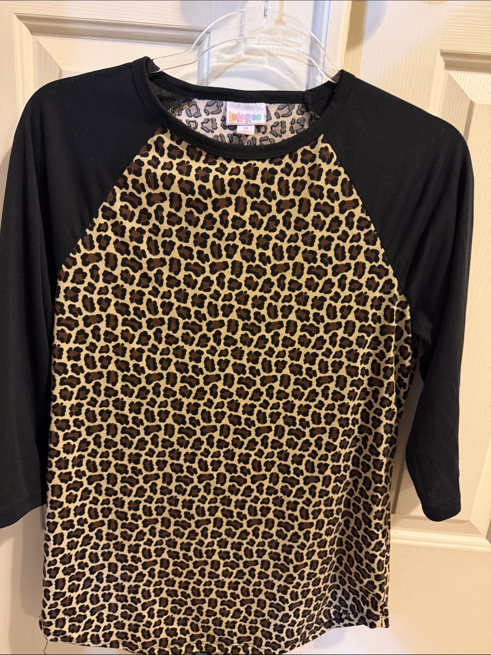 LuLaRoe Black Raglan Tee with Leopard Print Front